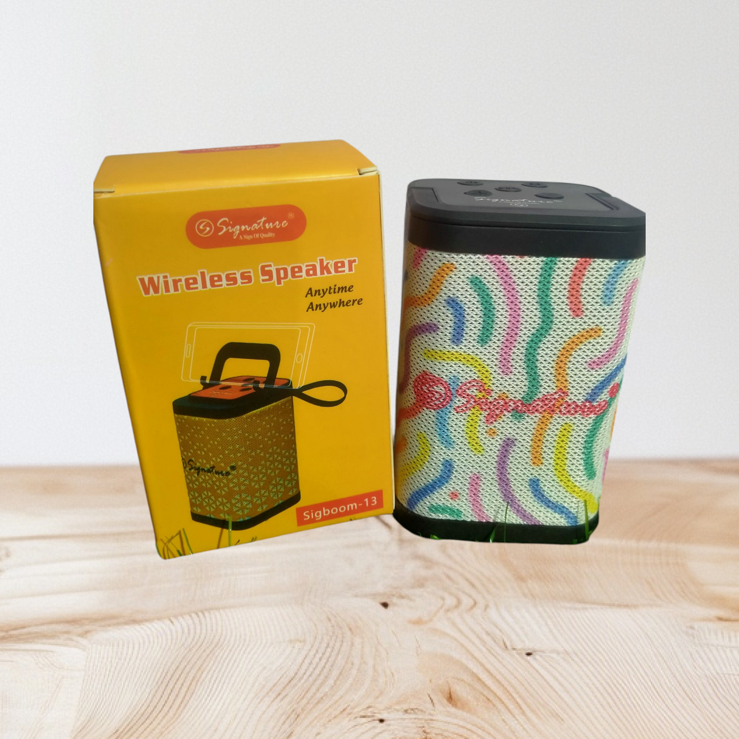 Signature brand wireless speaker, specifically the SIGBOOM-13 model.