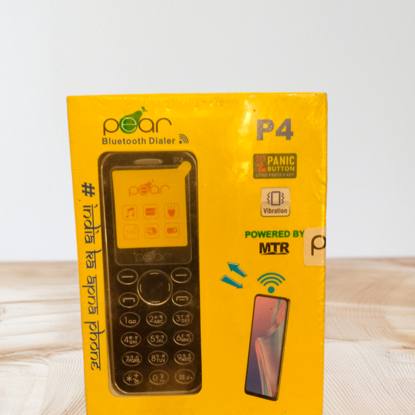 Pear P4 Bluetooth Dialer" feature phone, which is a basic mobile phone